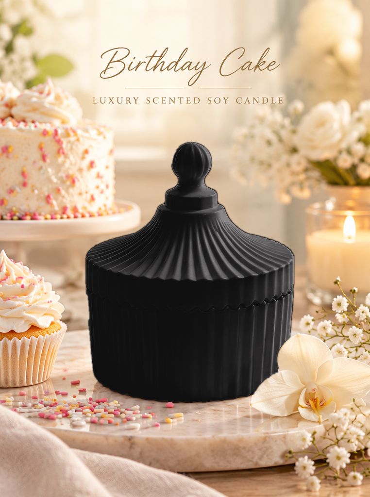 Birthday Cake candle in a black ribbed carousel jar with matching lid.