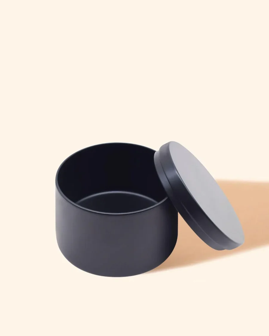 Noir tin with matching lid, shown empty