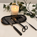 Black candle care kit with matching tray.