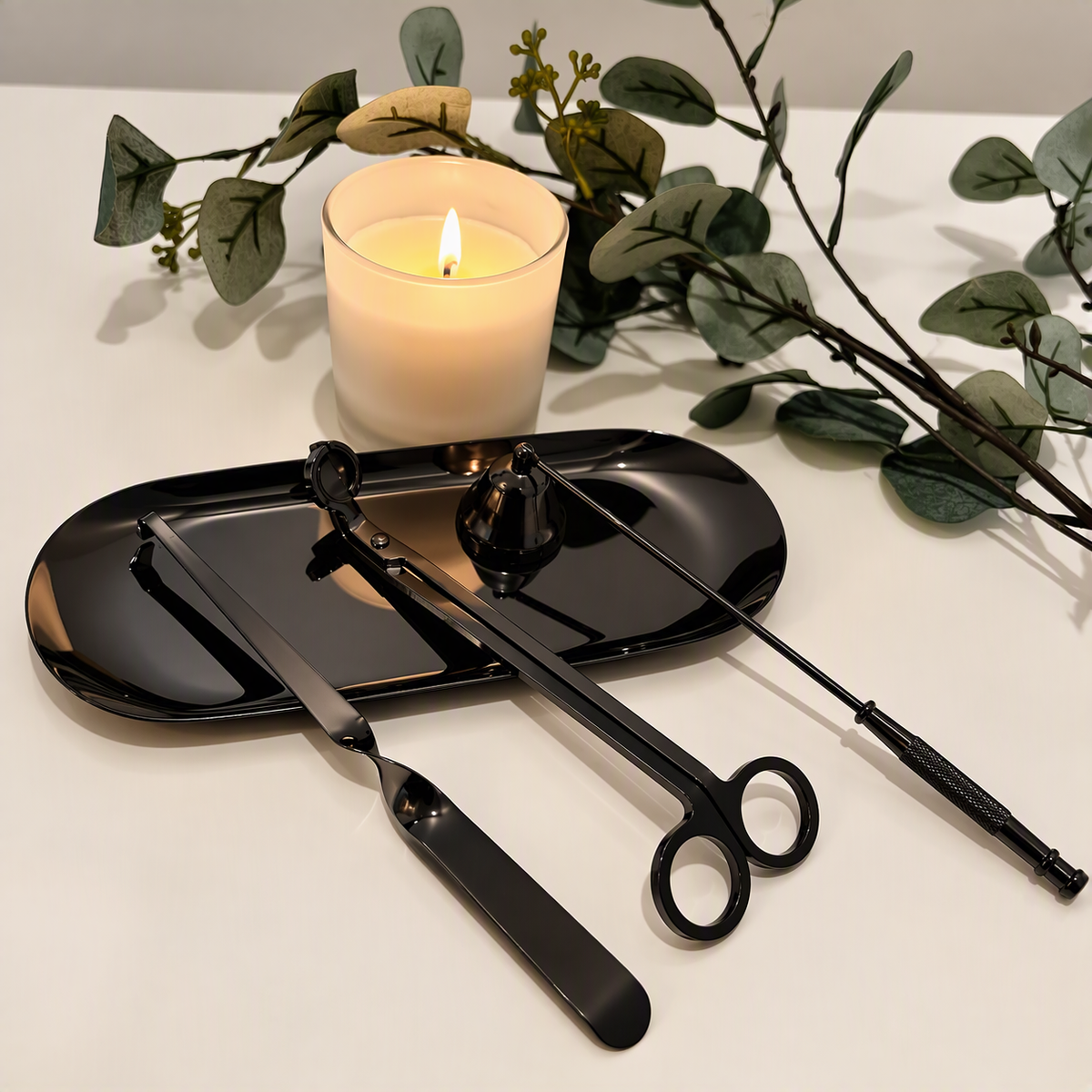 Black candle care kit with matching tray.