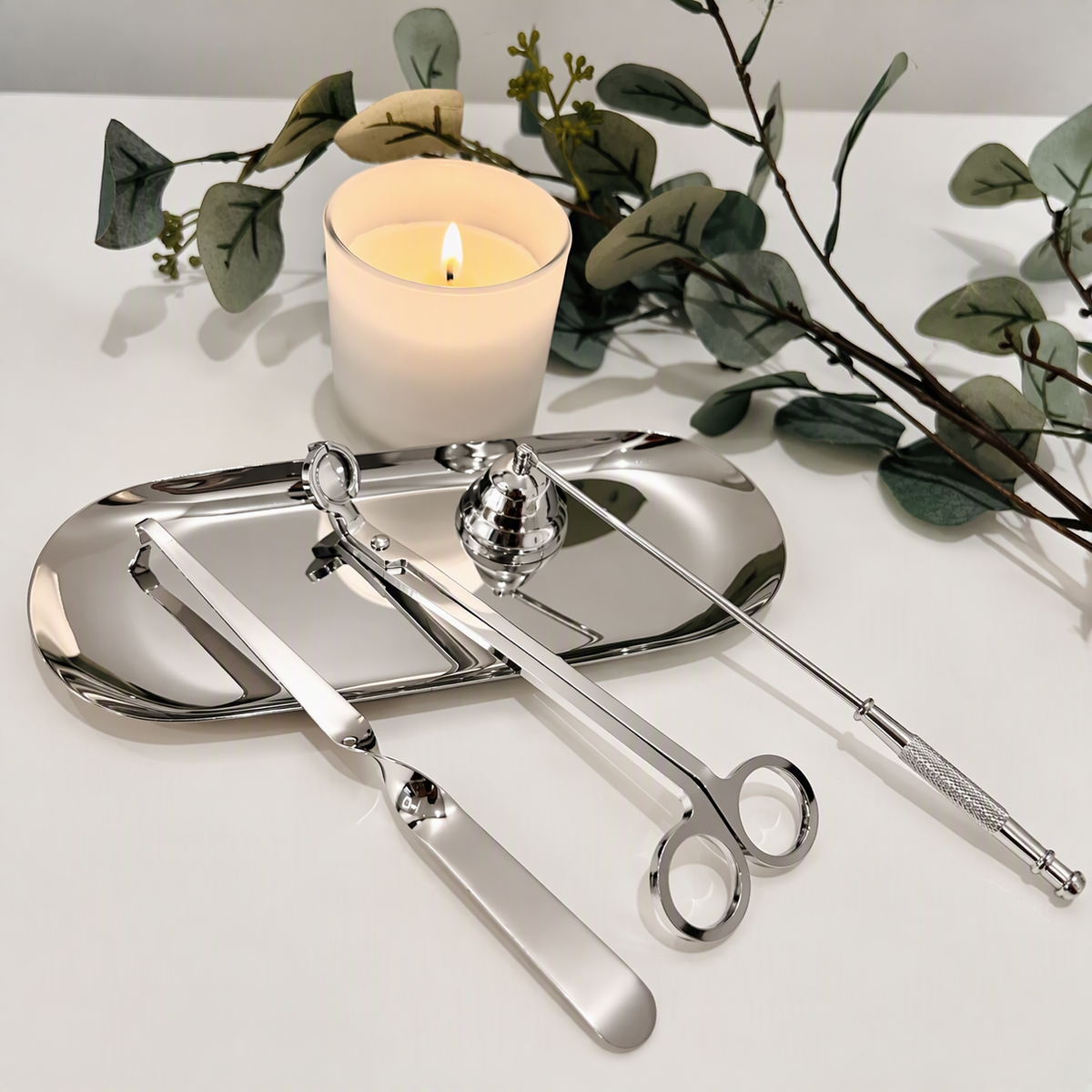 Silver candle care kit with matching tray.