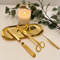 Gold candle care kit with matching tray.