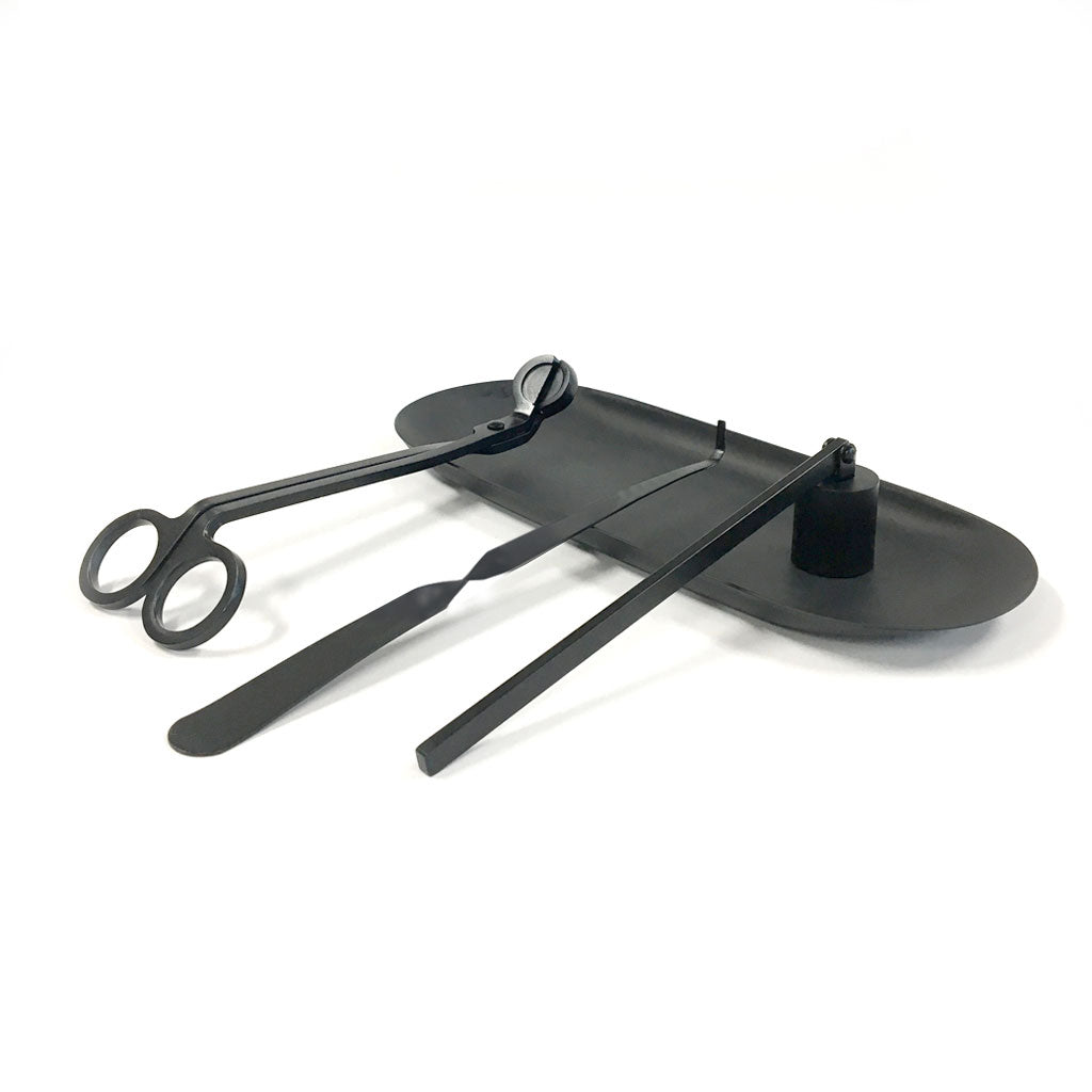 Matte black candle care kit with wick trimmer, candle dipper, snuffer and matching tray.